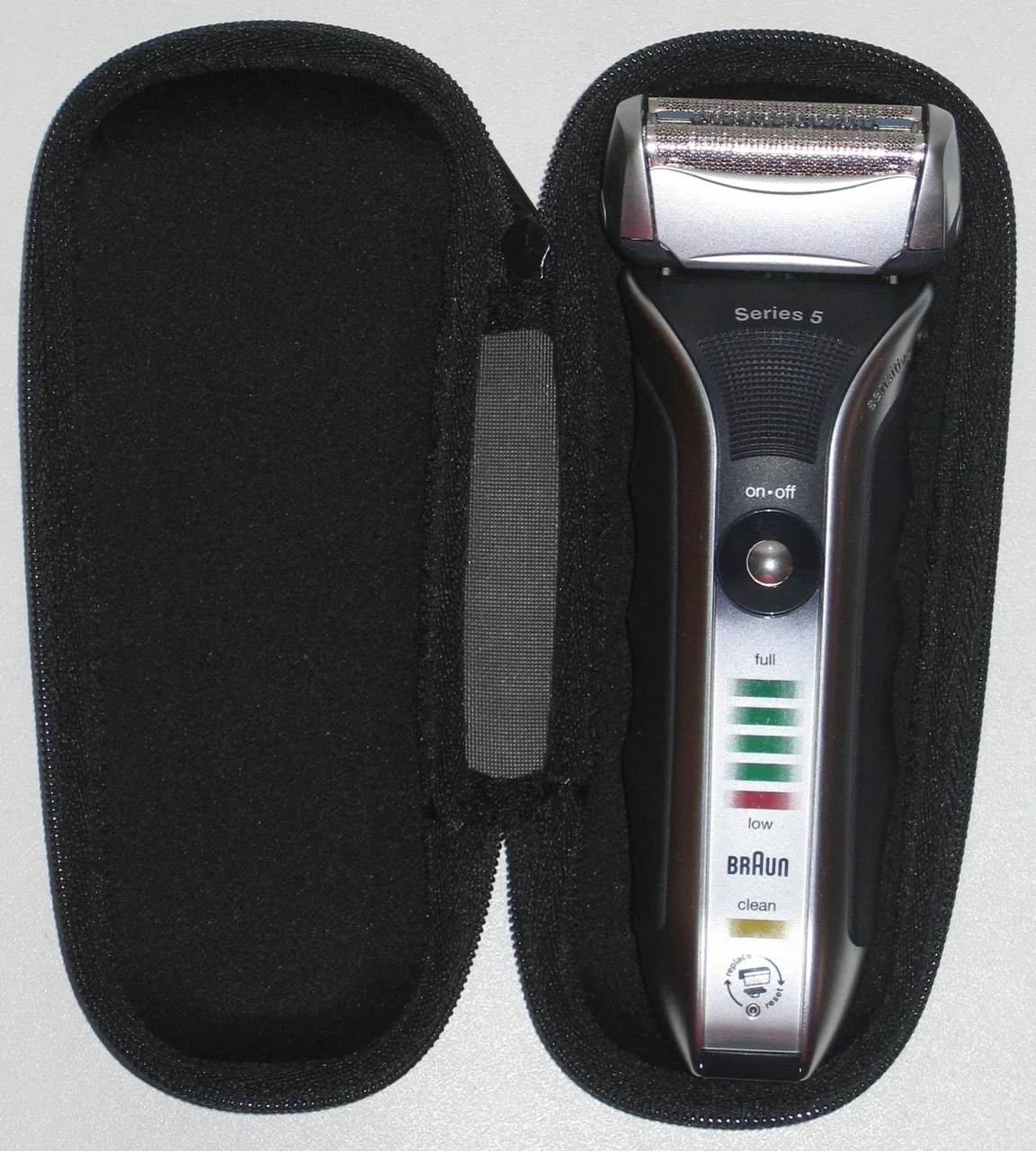 Braun 590cc inside its open protective travel case